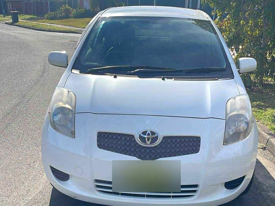 Front of a white Toyota Yaris from the Plenum rental fleet